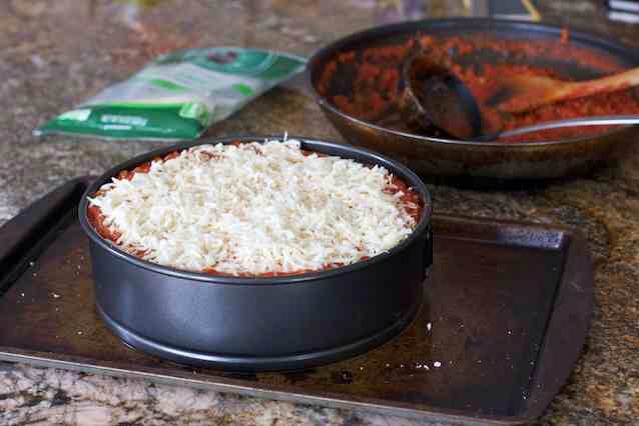 Add more sauce on top, then the mozzarella, then sprinkle parmesan on top