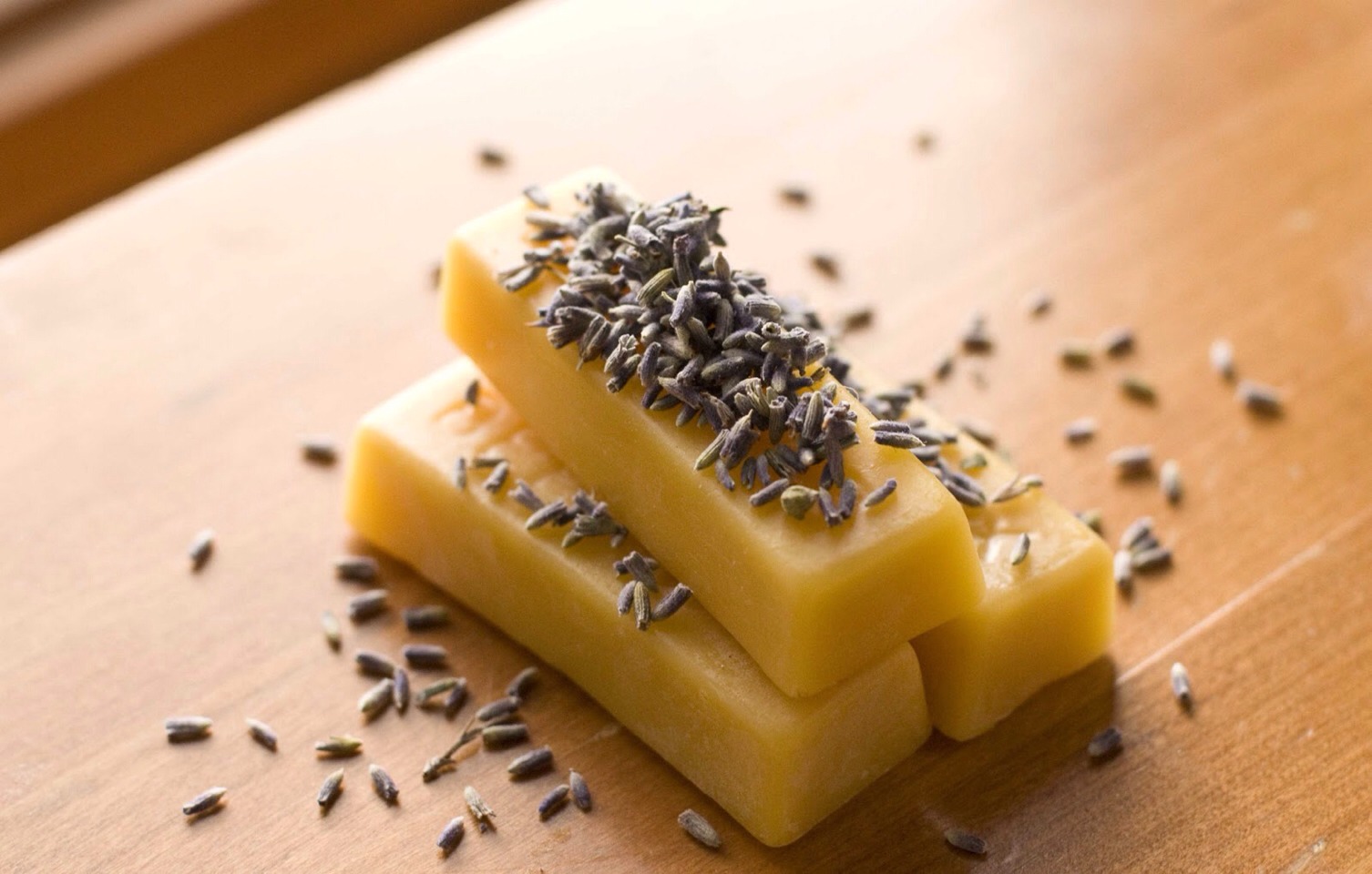 🌸 Melt 2 oz. of beeswax and 3 oz. of shea butter in a double boiler on medium-high heat. If you do not have a double boiler, fill a medium sauce pot about halfway with water. Place the beeswax and shea butter in a smaller sauce pot and place that into the water in the medium pot, then heat. 🍵