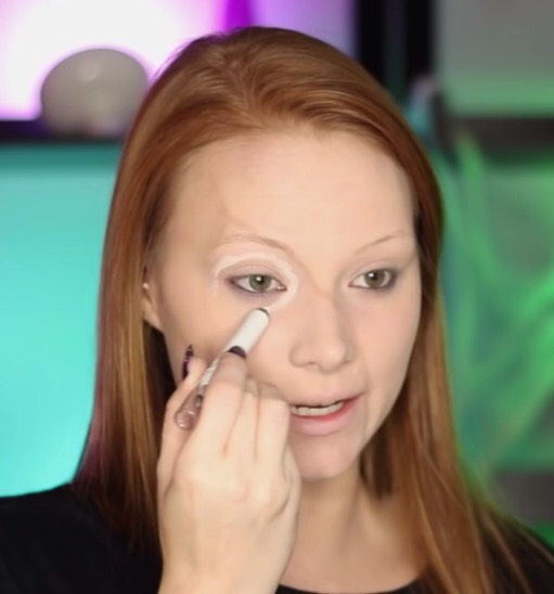 Leaving the eye area open, with a white eye pencil, follow around your eye socket .