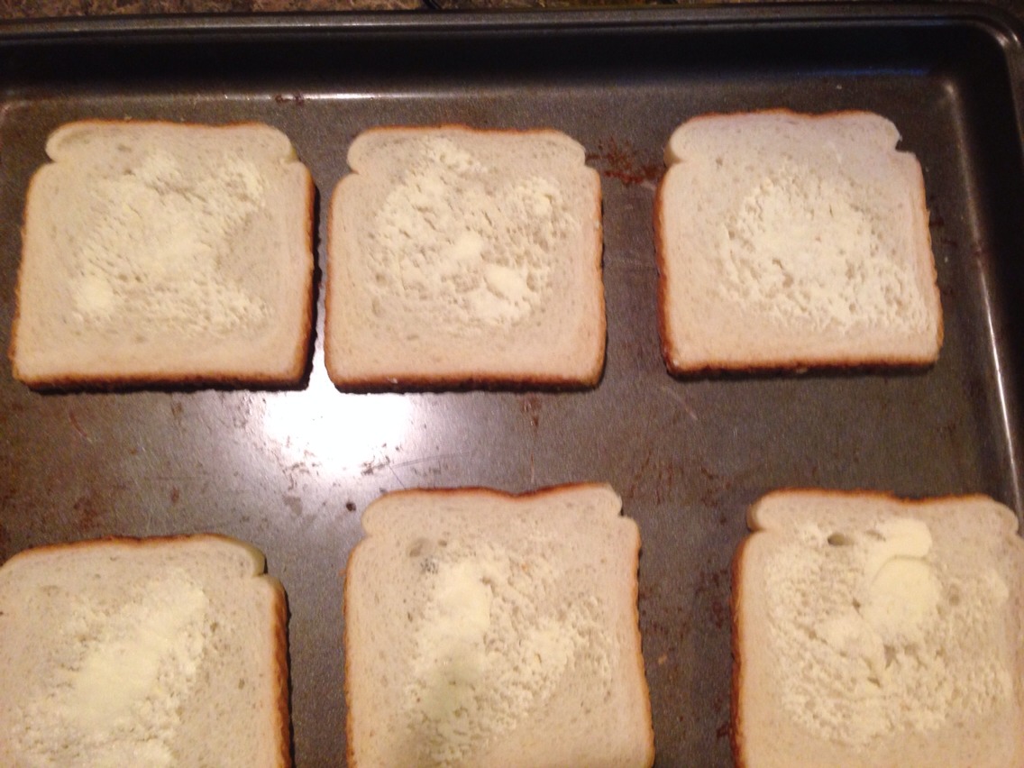 Then spread butter on each of the pieces of bread  