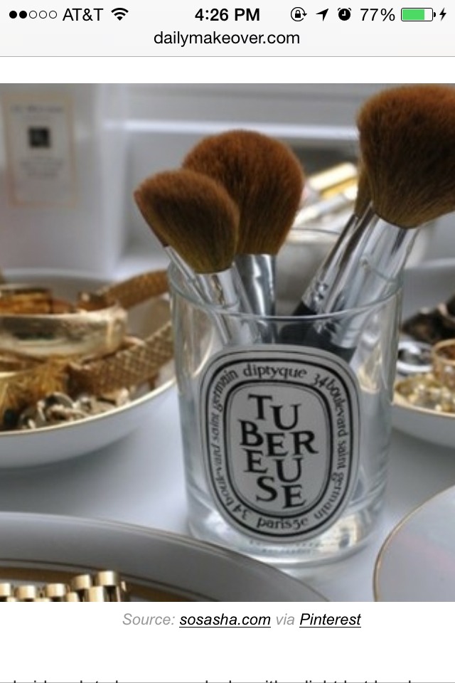 12. Repurpose an empty candle container as a makeup brush holder.