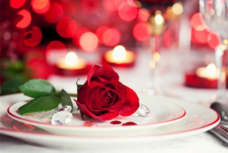 Rather than go out for a meal, cook one! Here's some recipes: http://www.bbcgoodfood.com/recipes/category/valentines-day
You could cook a surprise meal or even cook together.