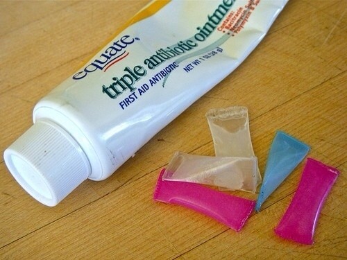 Cut the ends of straw and fill with ointment for single use . Seal by using a lighter at the ends :)