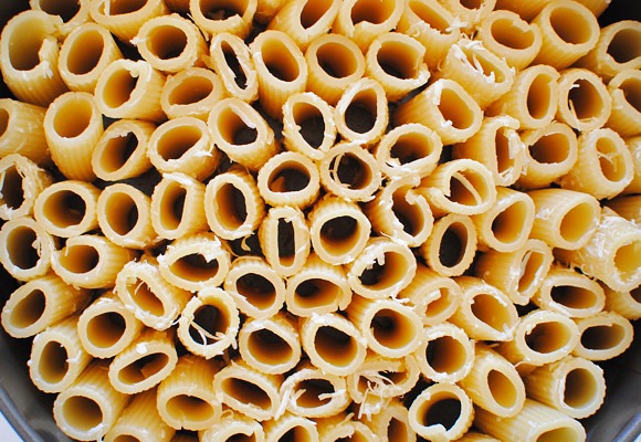 Tightly pack the rigatoni in the pan, standing on their ends.
Pour the meat sauce over the pasta. Push the meat down into the holes as best you can.
Slide into the oven for 15 minutes. Remove, top with mozzarella cheese, and bake another 10 to 15 minutes, or until cheese is browned and bubbly.

