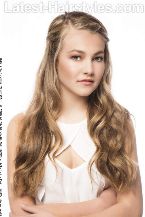 How To Style:
Apply a thermal protection spray to hair.
Curl sections of hair using an extra-large curling wand.
Braid the front pieces of the hair backwards.
Join both braids together in the back and secure with an elastic band. If the ends don’t reach, secure them with a bobby pin on each side.
