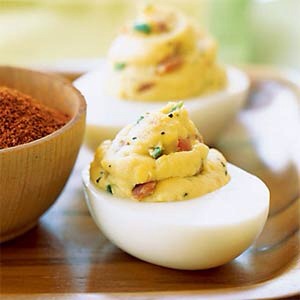 Easy Deviled Eggs: Put cooked egg yolks in a zip lock bag. Seal, mash till they are all broken up.  Add remainder of ingredients, reseal, keep mashing it up mixing thoroughly, cut the tip of the baggy, squeeze mixture into egg.  Just throw bag away when done easy clean up.