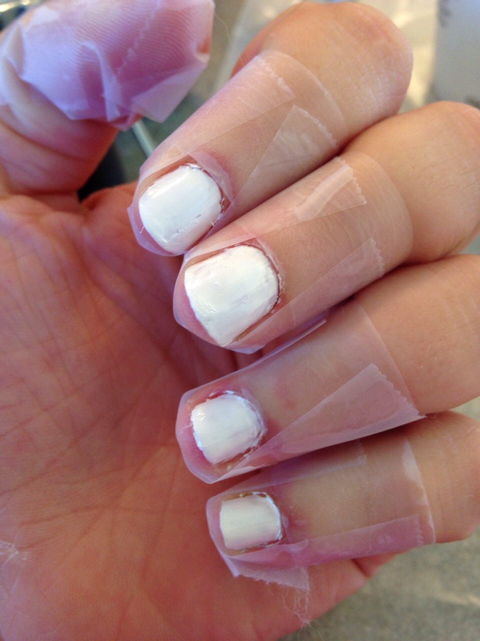 Paint your nails with  a base color I use Sally Hansen's hard as nails it was called White on.  Then put scotch tape around your nails