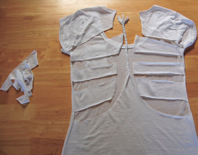 3. Next cut each side section into three three strips.
*Tip* I cut out fabric in between the strips but if you want thicker braids, don't leave any space.