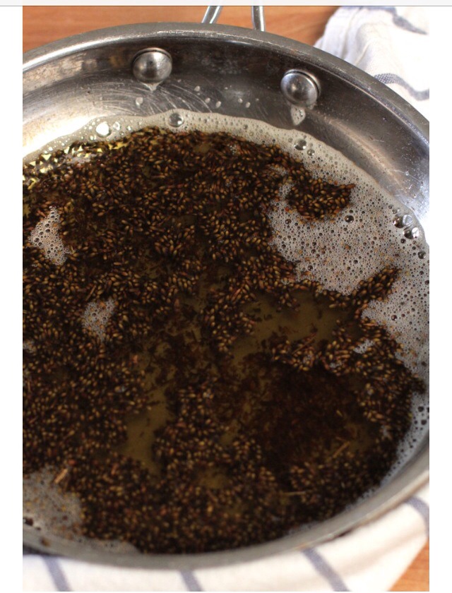 Step 1
In a large pan, combine the coconut oil, olive oil. Allow the coconut oil to melt over low heat. Once melted, add in the dried lavender and calendula. Keeping the heat on low, allow the herbs to infuse for 30 minutes.