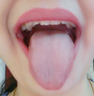 Tongue stretch
Sit up straight and slowly raise your chin so that you're looking at the ceiling. Keep your shoulders relaxed to avoid neck strain. Stick your tongue out and down, trying to get the tip to touch your chin. Hold this position for 10 seconds, then relax.
