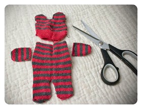 3. Next cut out your legs and arms. You should have 4 cut out parts. Head, 2 arms, and the body.