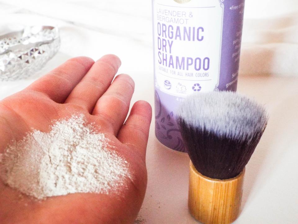 Apply dry shampoo with a powder brush so you don't accidentally douse your roots with too much product.