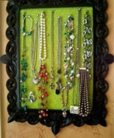 A picture frame with cardboard and fabric of your choice. With as many tacks as you'd like 