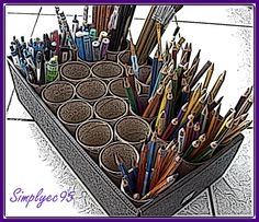 recycled tissue rolls as pencil, pen and paint brush holders... such a great idea for the craft room and the earth as well !!