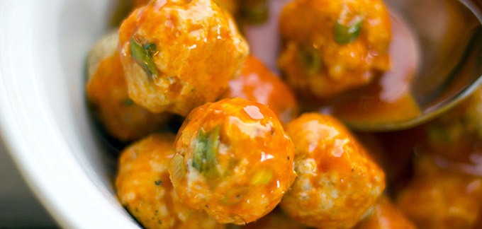 4. Serve meatballs with blue cheese sauce for dipping, and garnished with a sprinkling of the remaining green onions. Enjoy!