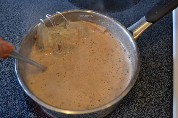 3) Once you feel like your tea has brewed sufficiently in your milk, then add chocolate to your mixture and stir.