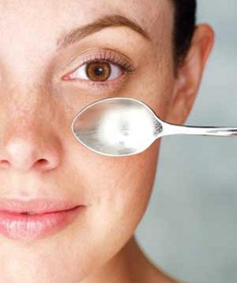 Step 2: Cool Down:
Stick a metal spoon in the fridge, or run it under very cold water, then gently press its curved back area under your lower lids for a bit of relief
