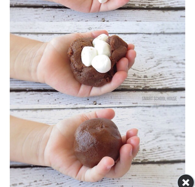 Put a few small marshmallows inside the cookie and mould it around them. Remember this is when the cookie is raw