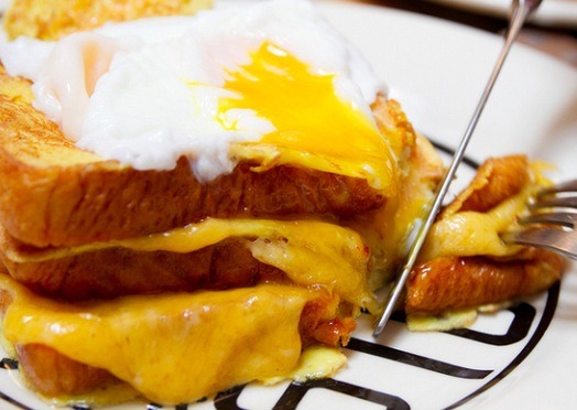 17. Double Decker French Toast Grilled Cheese Sandwich Topped and Filled with Poached Eggs