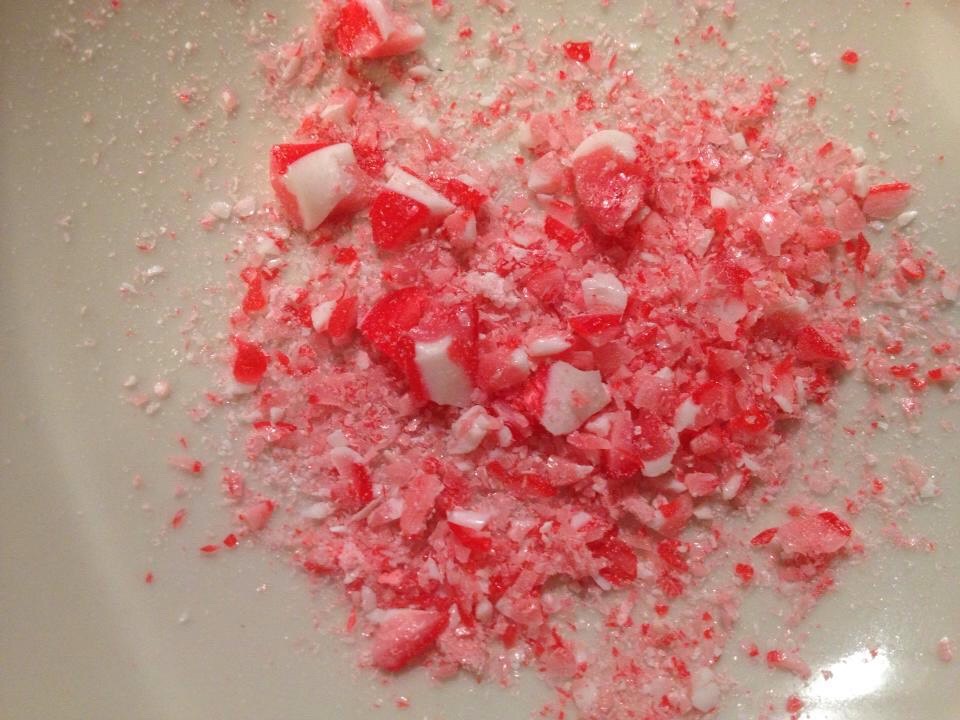 Take the wrapper off and crush up the candy canes. The best way to crush them is put them in a bag and tie it up and hammer it a couple of times.