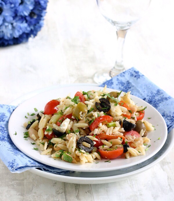 Orzo Salad with Cannellini Beans and Olives

This salad has a distinctly Mediterranean feel to it — between the orzo, the feta, and the two different kinds of olives, you'll feel like you've jetset to a faraway island without ever leaving your dinner table.