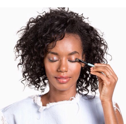 Step 2

A brown iridescent shadow is more compelling than a matte neutral, but it's subtle enough to let the bright eyeliner retain star billing. Dorman recommends applying it with a firm, slightly oval brush. In certain lighting, a glimmer of blue dances across the lids—gorgeous.