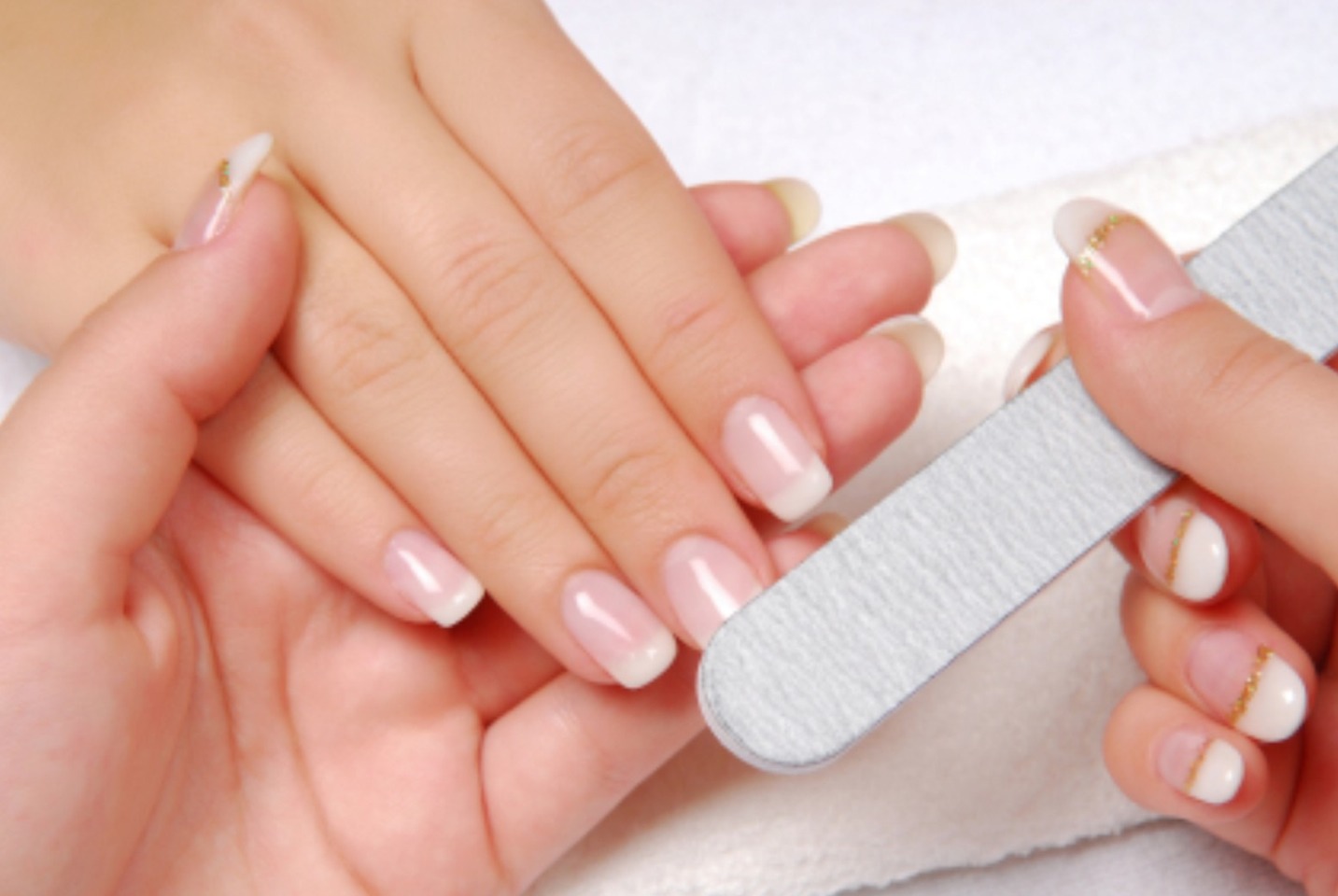 While your feet are soaking give yourself a manicure. Use a nail file to shape, cuticle oil to strengthen and then clear polish for a sleek finish.