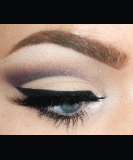 Ravndahl's false lashes (NYX Lashes in EL107 and NYX Half Lashes) finish off the cut crease eye makeup look.