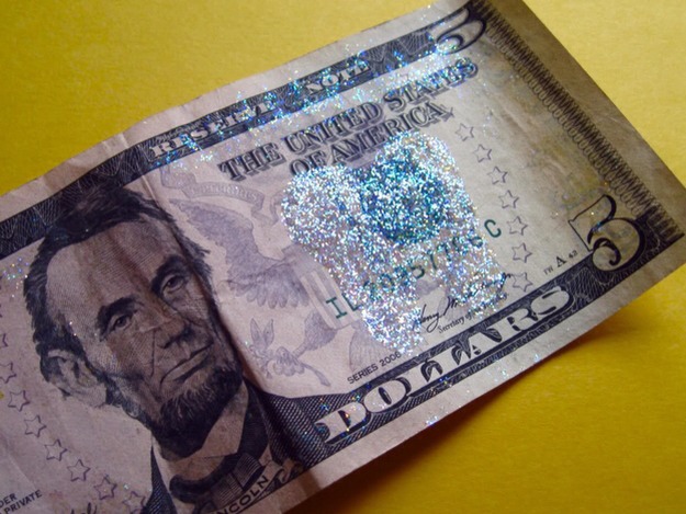 22. Use glue and glitter to make “tooth fairy money.