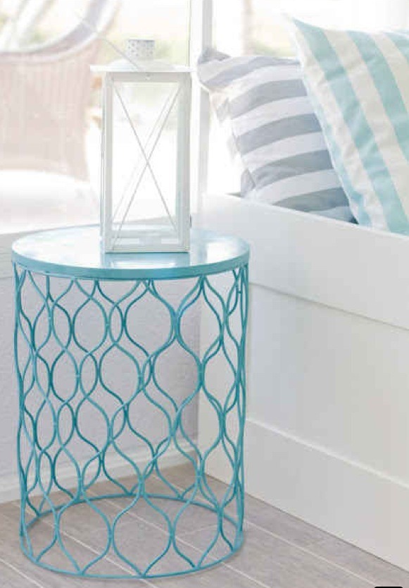Spray paint the waste paper basket your favorite color, then flip it over for an affordable and compact piece of furniture.
