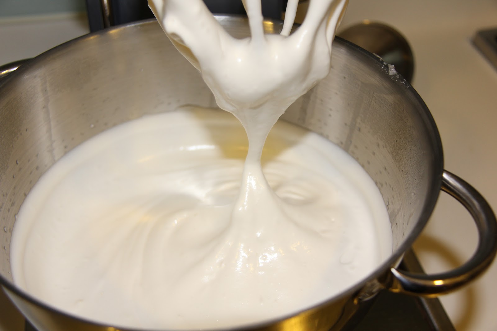 Melt 4 tablespoons of softened butter and 5 cups of large marshmallows in the microwave until fluffy (1 1/2 - 2 minutes).