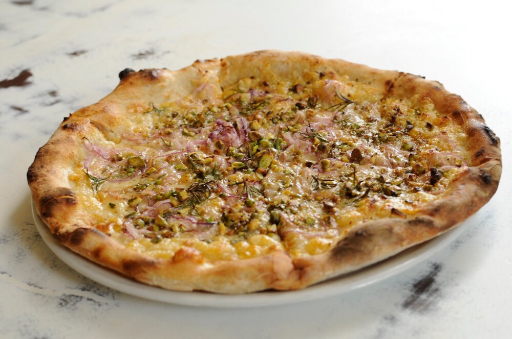 24. Bianco Stretch dough into two thin 9-inch rounds; top with olive oil, salt, thyme, oregano and 1/2 cup robiola. Bake until crisp, then add 4 ounces each ricotta and bocconcini, olive oil and salt; bake until the cheese melts.