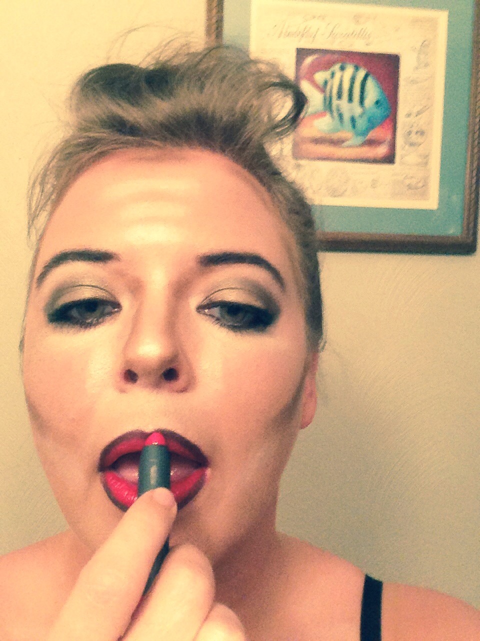 Reapply both liner and lipstick.