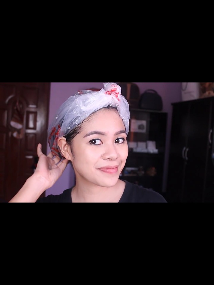 Now tie your hair and rape it like this for half an hour then take the bag off and then wait for 2 or 5 hours before you wash your hair you can leave it over night aswel  