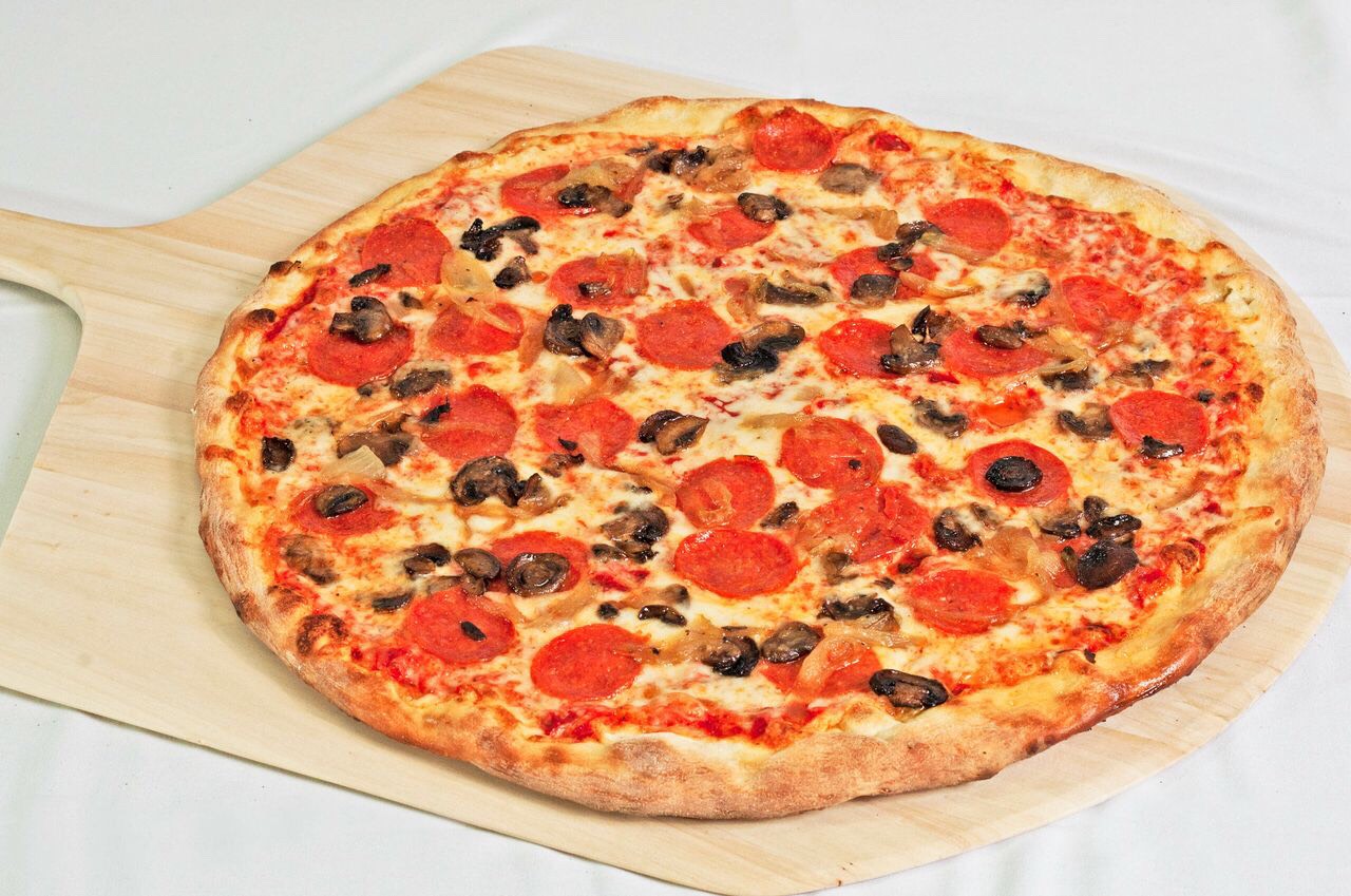 
7. Pepperoni-Mushroom Make New York-Style Pizza top with sauteed mushrooms and sliced pepperoni before baking.