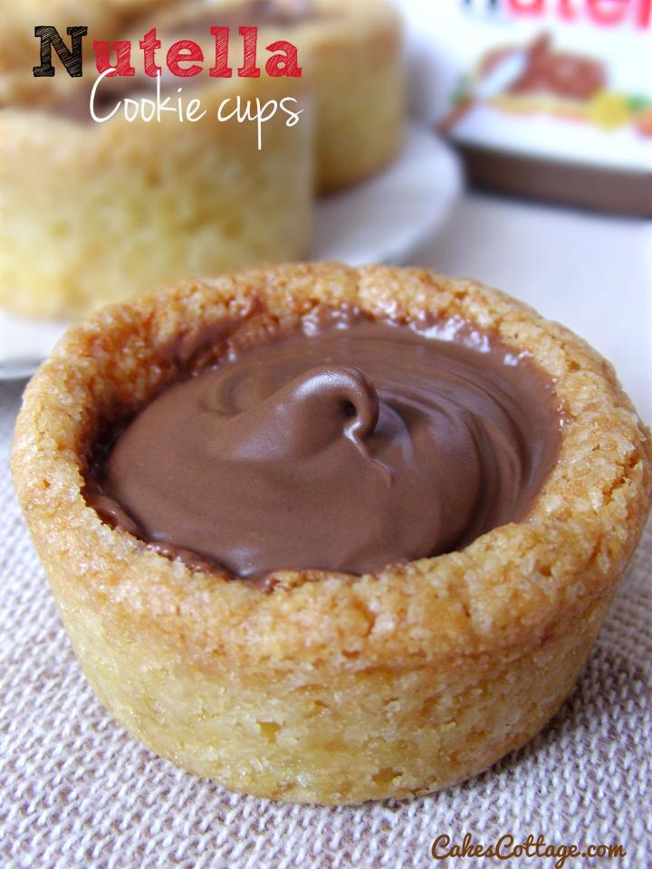 Add 1 tbsp Nutella to each cup – it will start to melt quickly so you can swirl it around and make it nice and smooth.
Let cool 15-20 minutes in pan (At first the Nutella is nice and melty – be sure to eat at least one cup this way!), and serve.