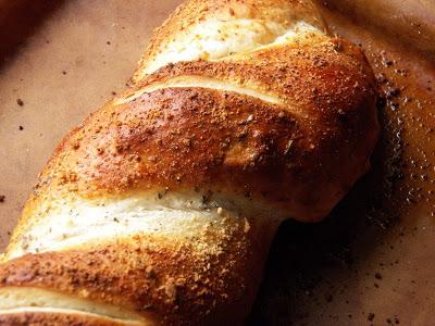 Grate Parmesan cheese over loaf.
Bake 30-35 minutes or until deep golden brown.  I switched over to my stoneware to bake this.  Cool 10 minutes.  Slice and serve with warm pizza sauce, if desired.

