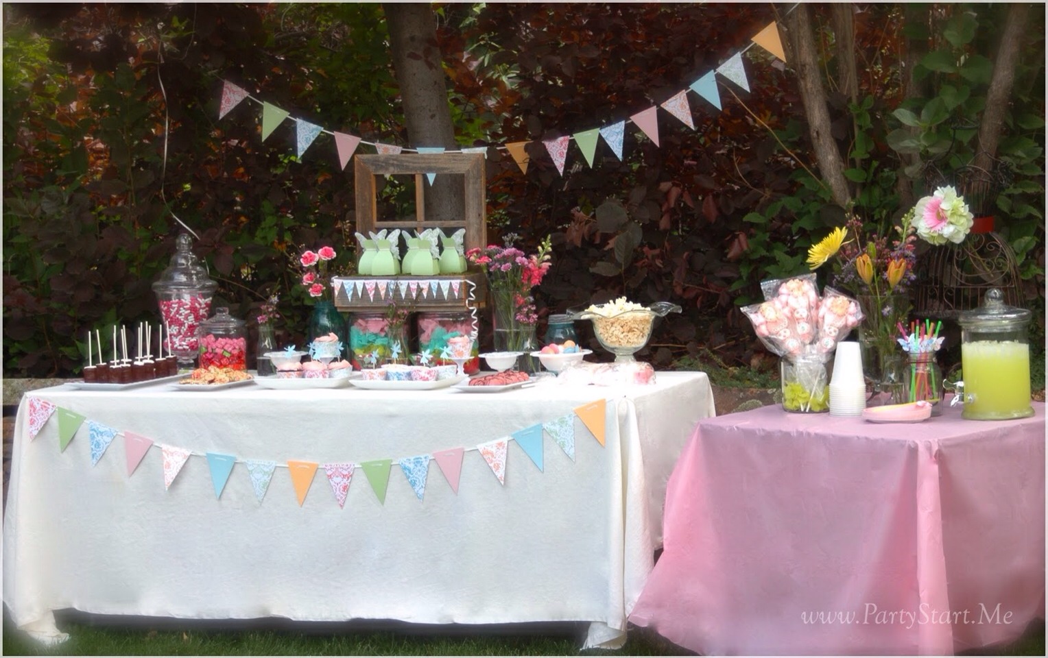 Use things from around your home.
Shabby sheek is really in fashion and looks amazing.
Use thing like old table cloth or bed sheet
Ld chime
Mason jars painted if needed
Photo frames etc