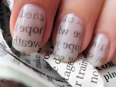 paint your nails white dip in rubbing alcohol and press against newspaper for at least 30 seconds and peel off. (like a tattoo)