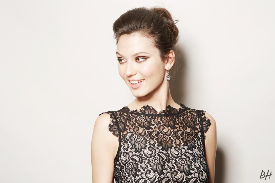 This messy bun is an edgy take on a classic—the ideal look for after-work holiday fun.

