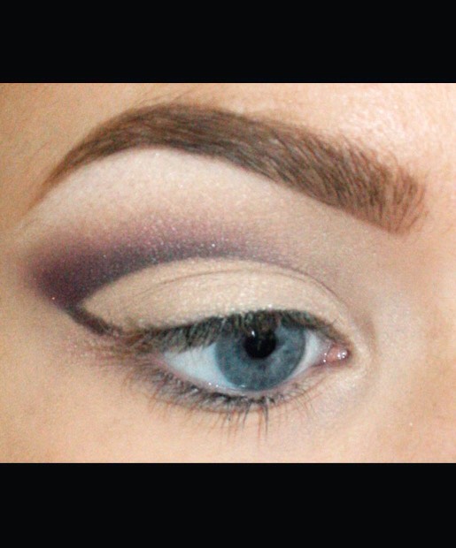 Using the top line of your eyeliner as a guide, apply any eye shadow you'd like (pictured: MAC Eye Shadow in Plum Dressing) over the line and slightly above it, blending in toward the inner corner of your eye. You can also clean up any mistakes along the way with your white eyeshadow.