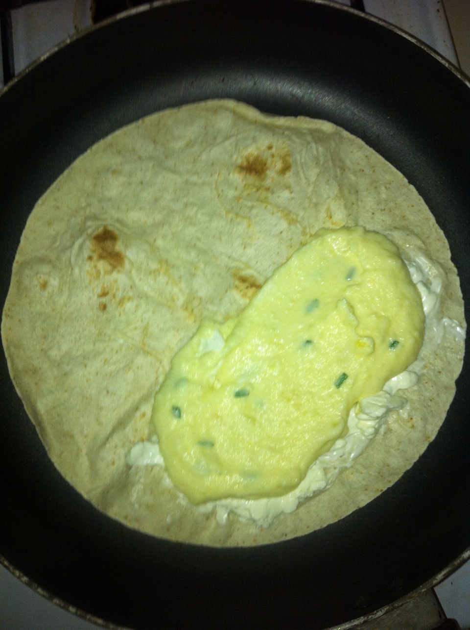 Lightly butter each side of the quesadillas.Preheat a large skillet over medium heat. Place a quesadilla into the preheated pan, and cook until golden brown and crispy, then turn over, and continue cooking on the other side until browned, 2 to 3 minutes per side. Serve with salsa and sour cream! 