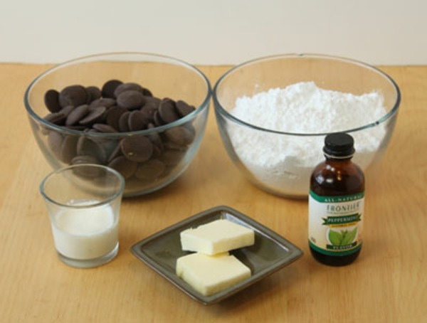 Combine condensed milk and peppermint extract. Beat in confectioners sugar slowly, to form a stiff dough. Form into 1 inch balls , place on wax paper and flatten with the bottom of a cup. Let patties dry at room temperature for two hours, turn once.