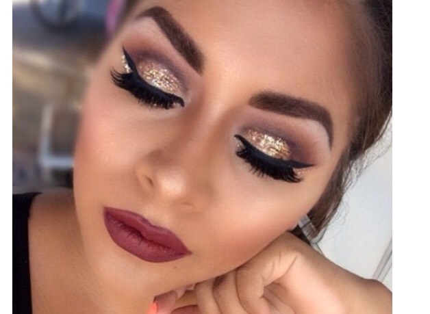 18. Gold glitter cut crease, winged liner, magenta lip. 