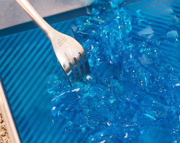 Cut apart the jello with a fork for easy distribution in glass cups.
