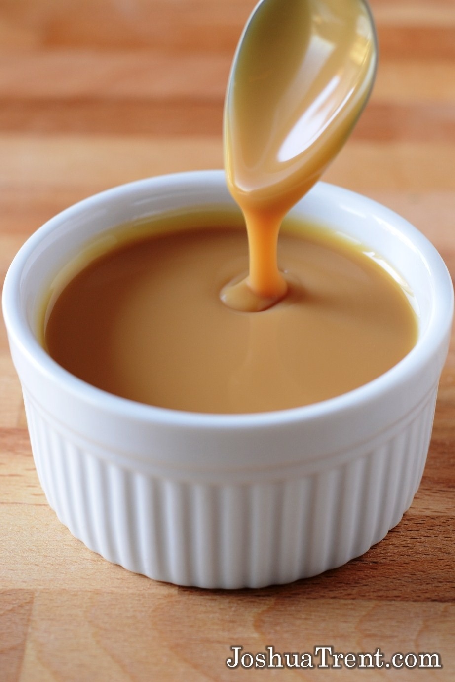 Reduce the heat and add the condensed milk, vanilla and brandy.  Stir until it’s nicely combined and a good caramel color, then take it off the heat