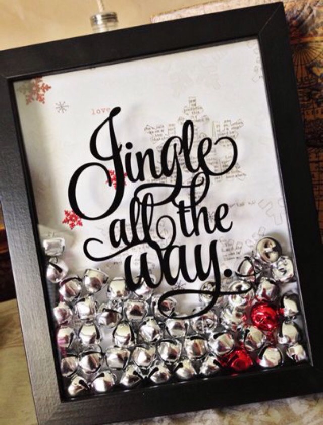 Use a shadow box frame. Put in a cute sheet of card stock. Then, fill with jingle bells. On the front glass part, use stickers to write the words you want it to say.