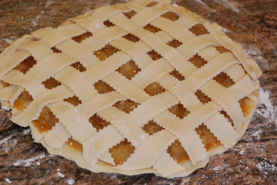 Unroll the 2nd pie crust and cut into strips. I used a wavy edged pastry cutter.
Layer the pie crust strips over the apple filling in a lattice formation.