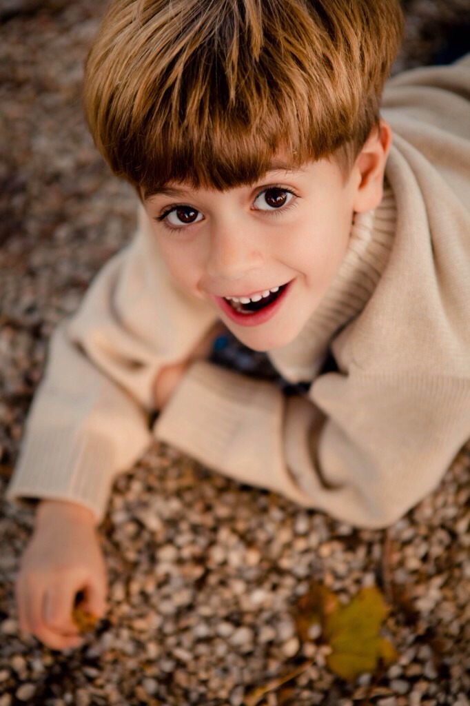 5-      Take pictures from above.  I super- love photographing kids from above.  The angle is pretty cool but it’s the light in a child’s eyes that sells me on this perspective.   Even if you photograph in shade looking up towards the sky will give a beautiful twinkle in the eyes.