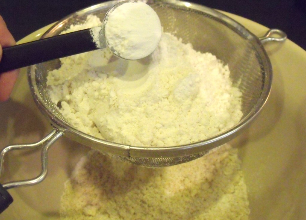 Sift confectioners' sugar and ground almonds in a separate bowl